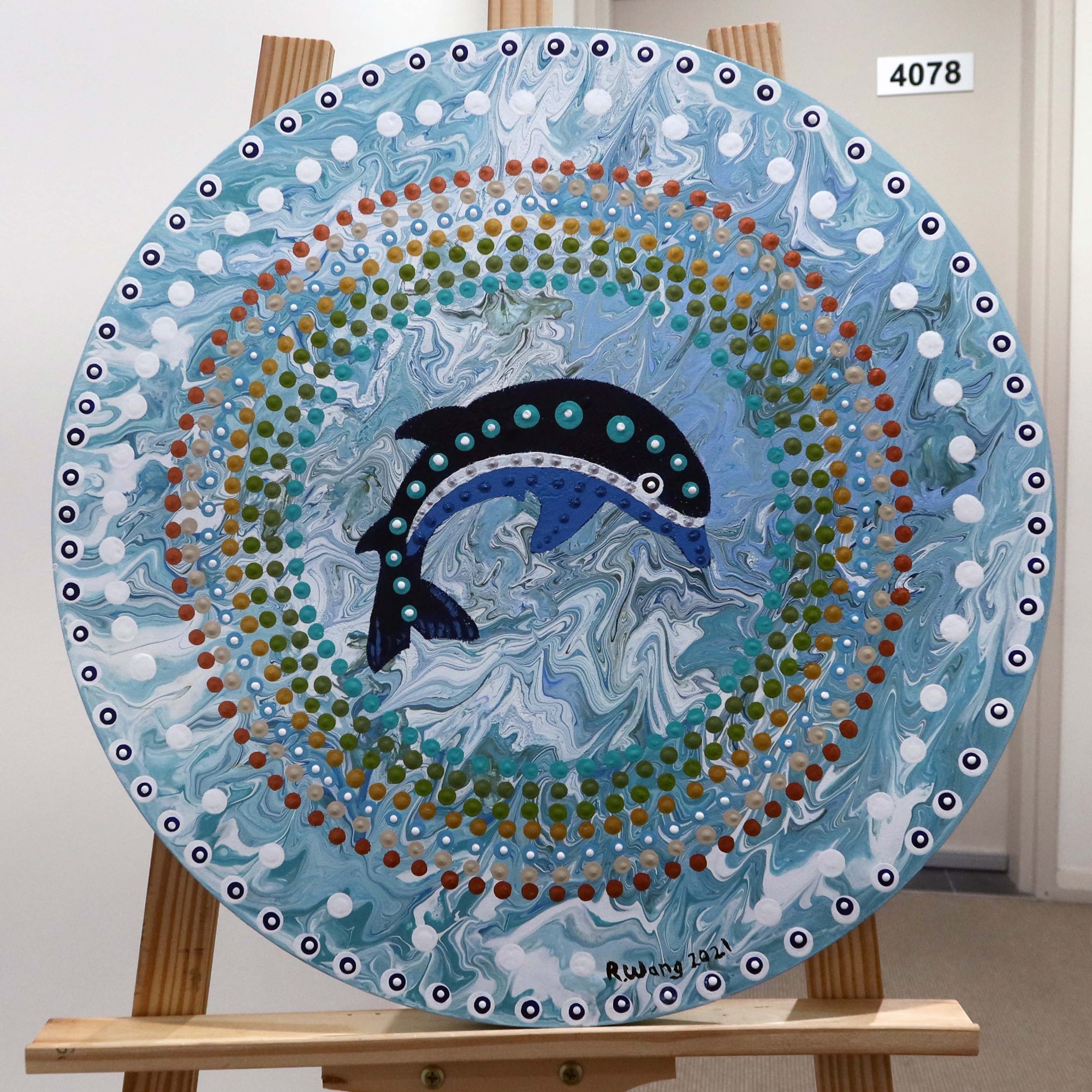 Artwork by Robb Wang featuring dolphins among layered blue patterns